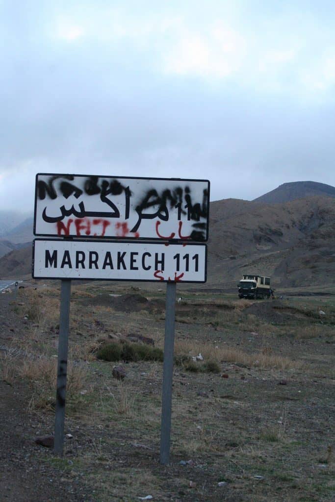 Sign Marrakech 111km during African Trails Atlas Mountain bush camp, Morocco (2011-10)