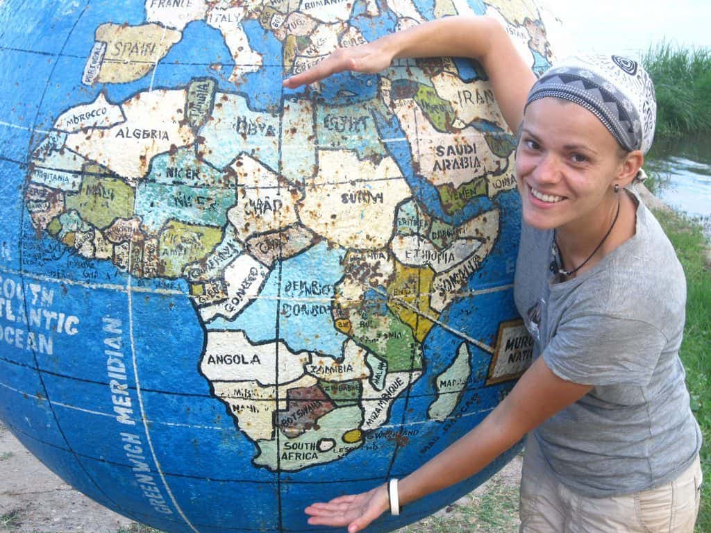 Carola and Africa on a globe, Murchison Falls National Park, Uganda (2012-05)