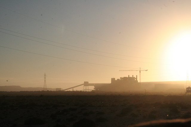 Factory in the distance at sunset in Western Sahara, Morocco (2011-11)