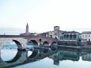 Almost perfect reflection of Ponte Pietra bridge, Verona, Italy (2016-01-20)