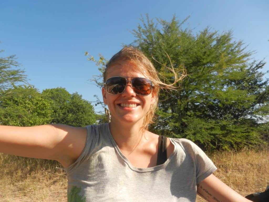 Carola hitchhiking near Lake Kariba in Zimbabwe (2012-04-10)