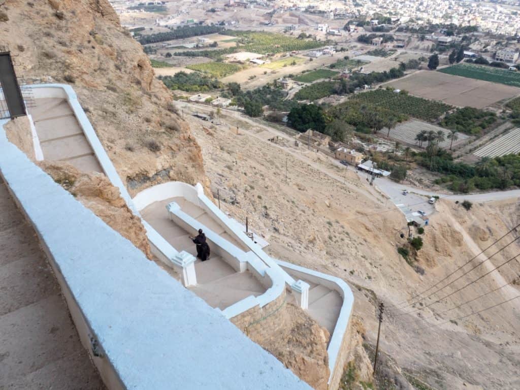 View from St George Monastery with monk heading for lunch, Jericho, Palestine (2017-01-15)