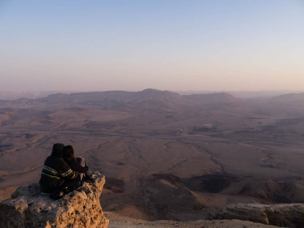 Couple at sunset on Camel Rock, Ramon Crater, Mitspe Ramon, Israel (2017-02-08)