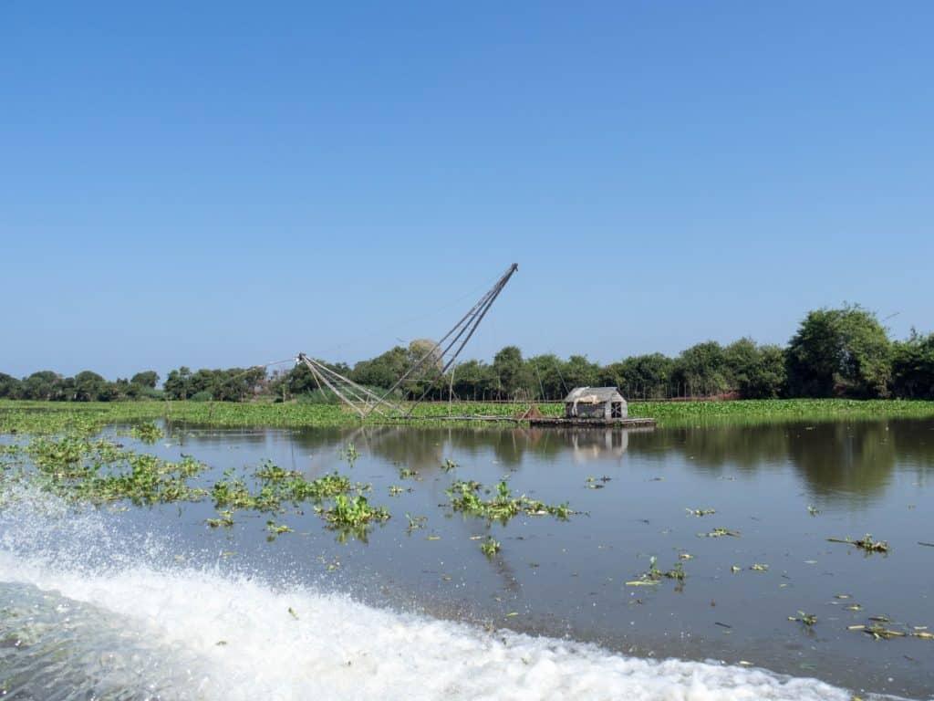 Fishing boat with large net and hut, Boat from Siem Reap to Battambang, Cambodia (2017-04-22)