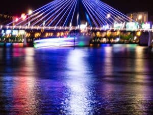 Lights on the bridge at night by the river, Da Nang, Vietnam (2017-06)