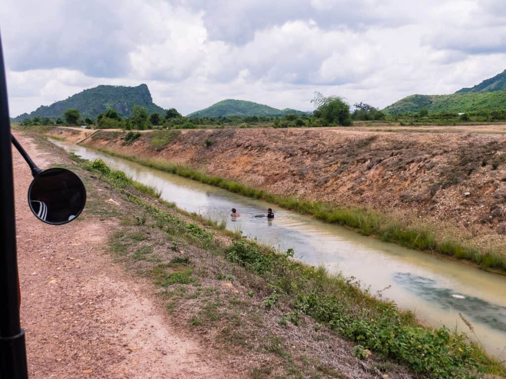 Channel and snail collectors en route to Phnom Chhngok Cave Temple, Kampot, Cambodia (2017-04-29)