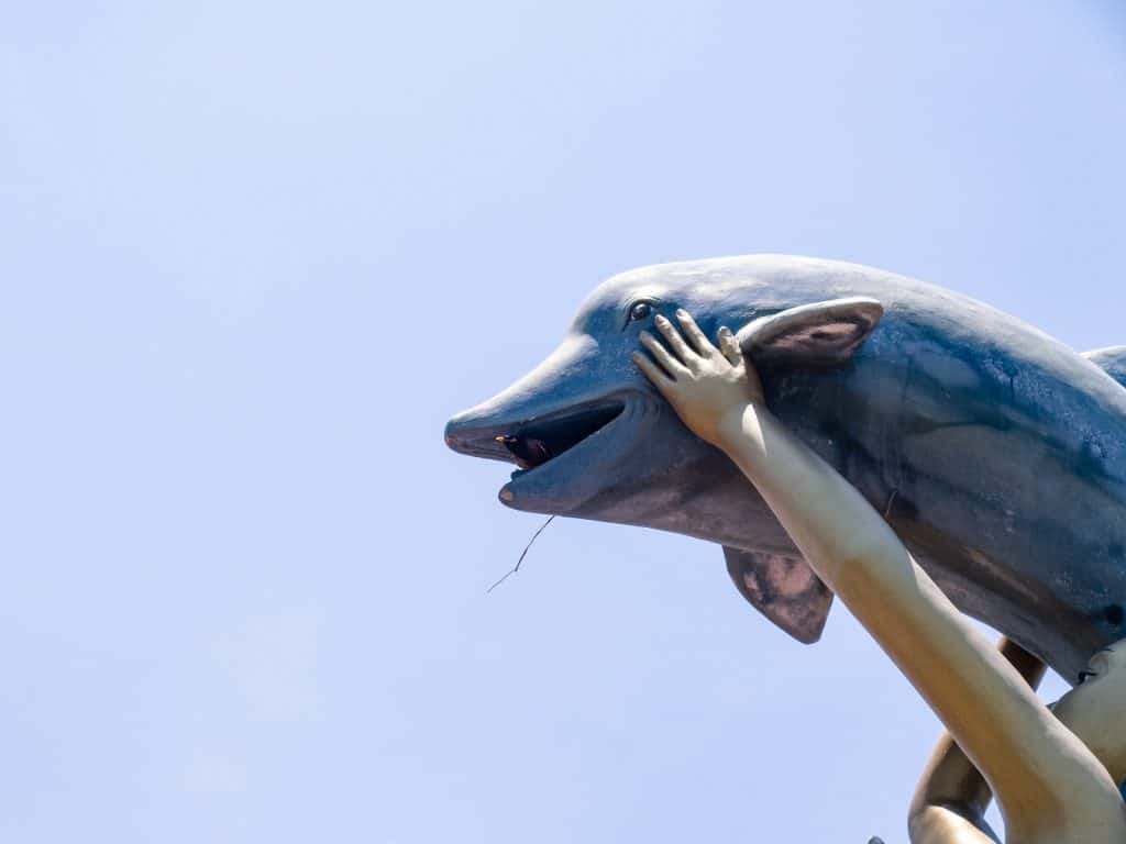 Dolphin sculpture with bird, Kep, Cambodia (2017-04)