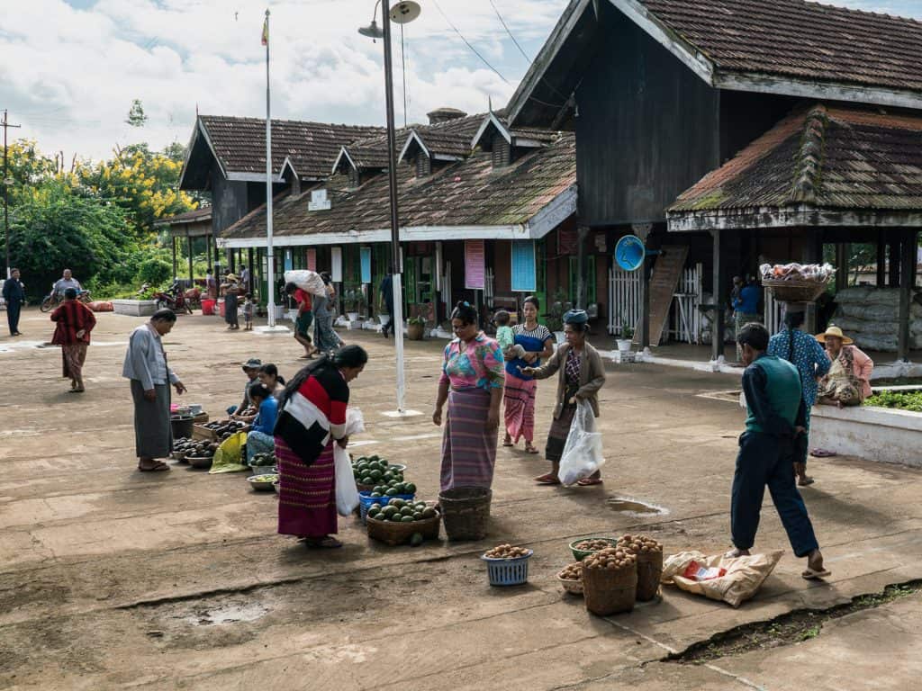 Myanmar train travels: Market at the train stations on the slow train Shwenyaung (Inle Lake) to Thazi, Myanmar (2017-10)