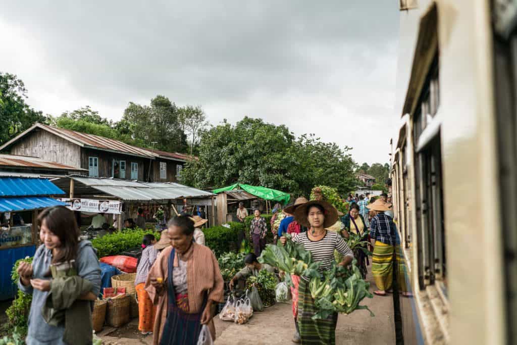 Myanmar train travels: Market at the train stations on the slow train Shwenyaung (Inle Lake) to Thazi, Myanmar (2017-10)