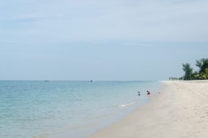 Kids playing at Tunjung Rhu beach, Langkawi, Malaysia