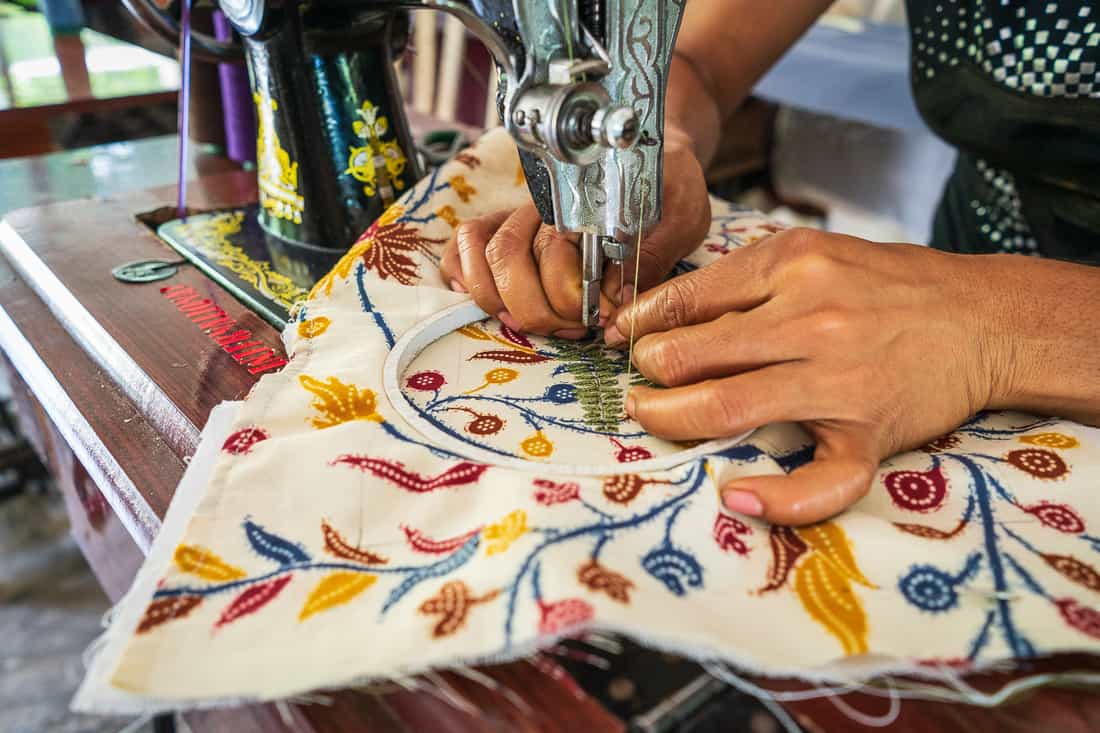 Sewing fabrics at Boneca de Ataúro, Vila, East Timor