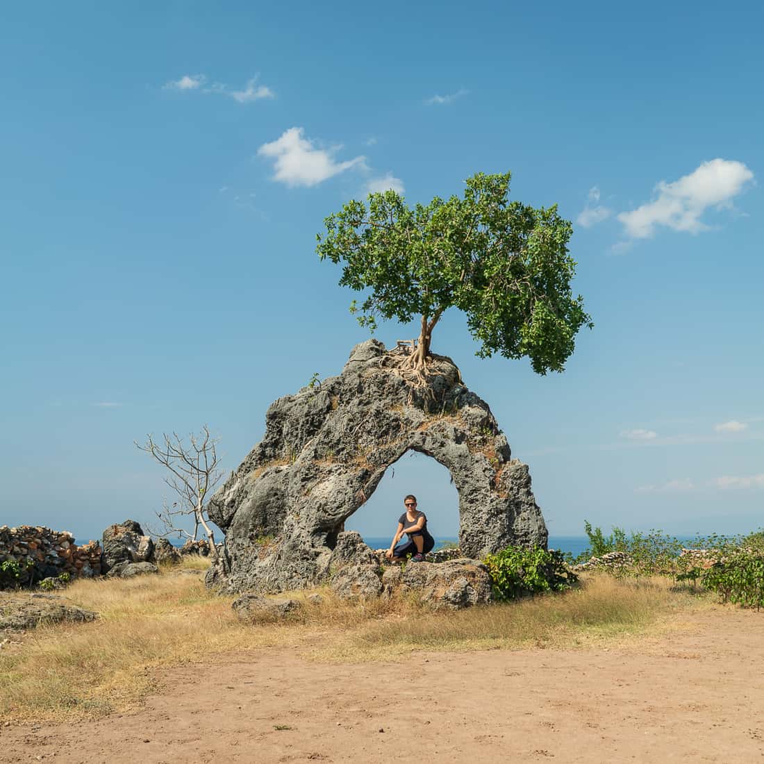 Carola at rock formation, Baucau beach, East Timor