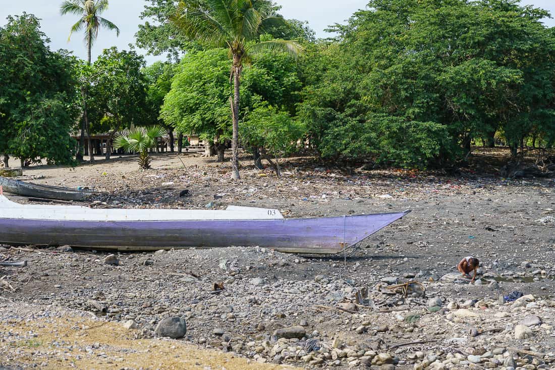 Boat and child at Suai Loro village, East Timor