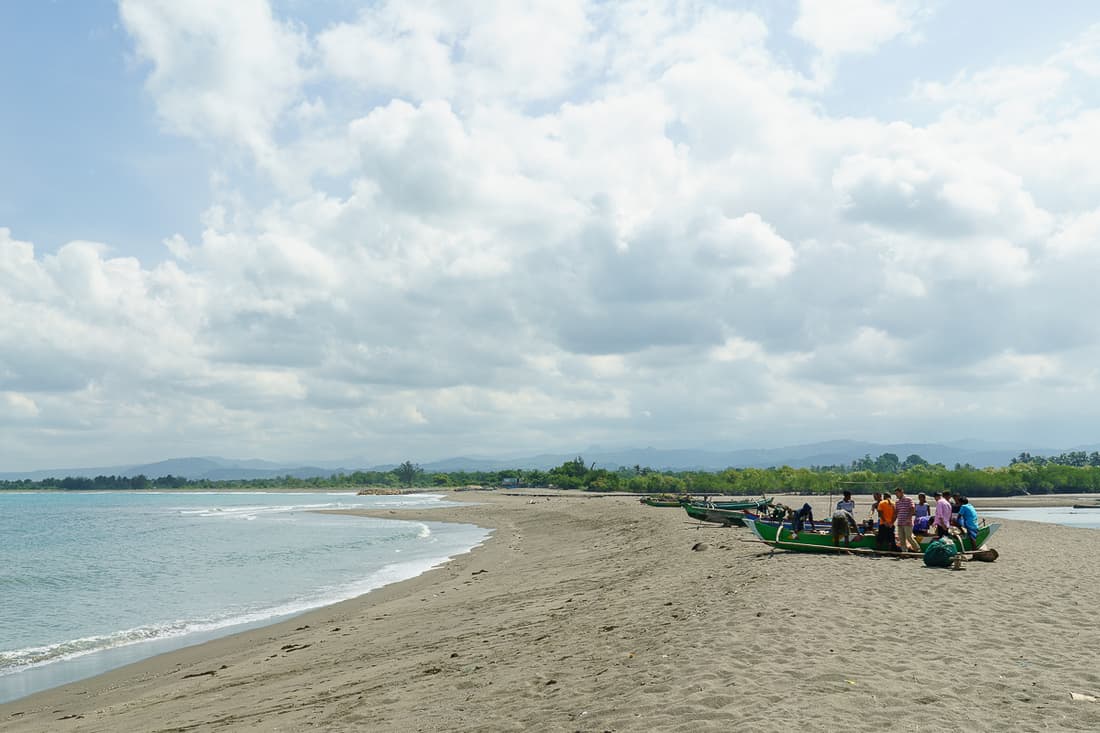 Fishermen selling their catch on Suai beach, East Timor