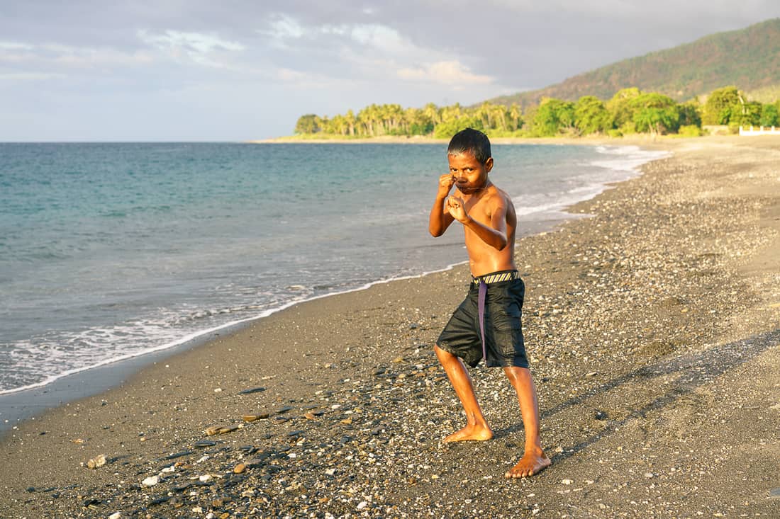 Boy at sunset on Liquica's Lauhata beach, East Timor