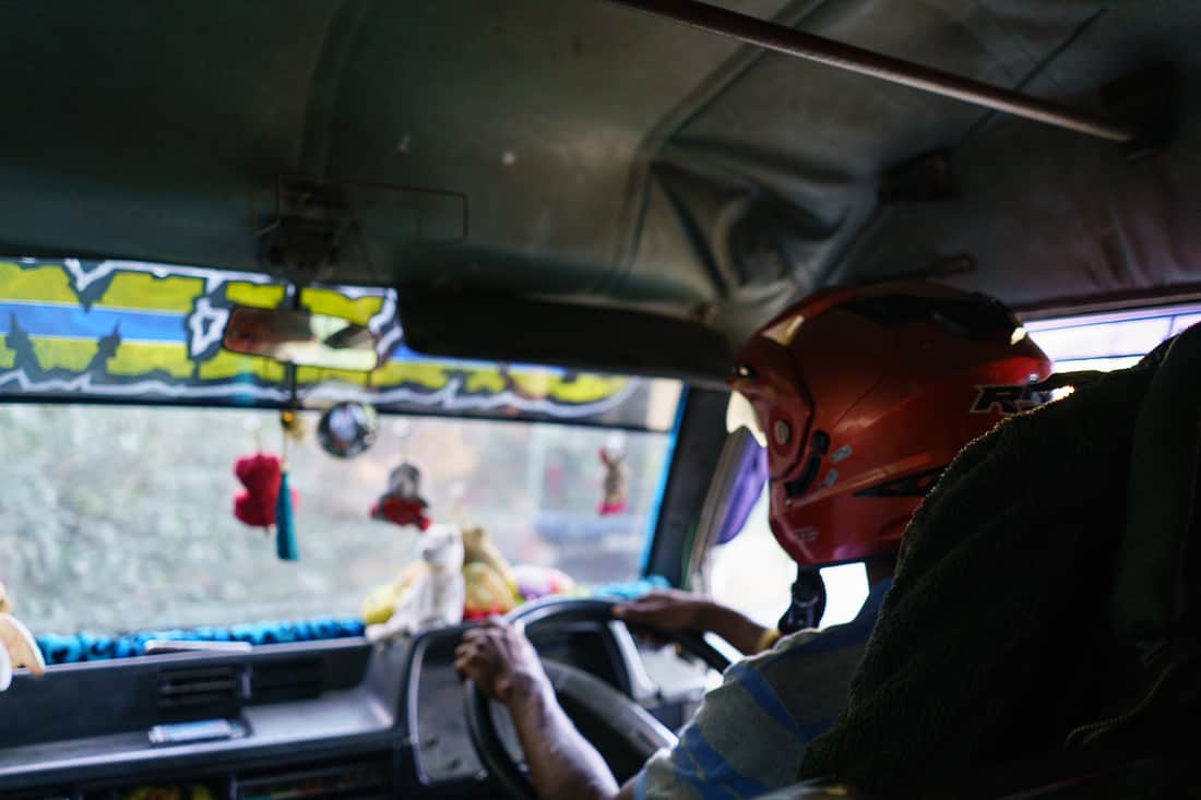 Bus driver with helmet going from Gleno to Letefoho, East Timor